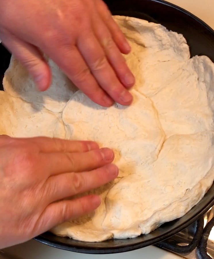 Pressing Biscuits into skillet