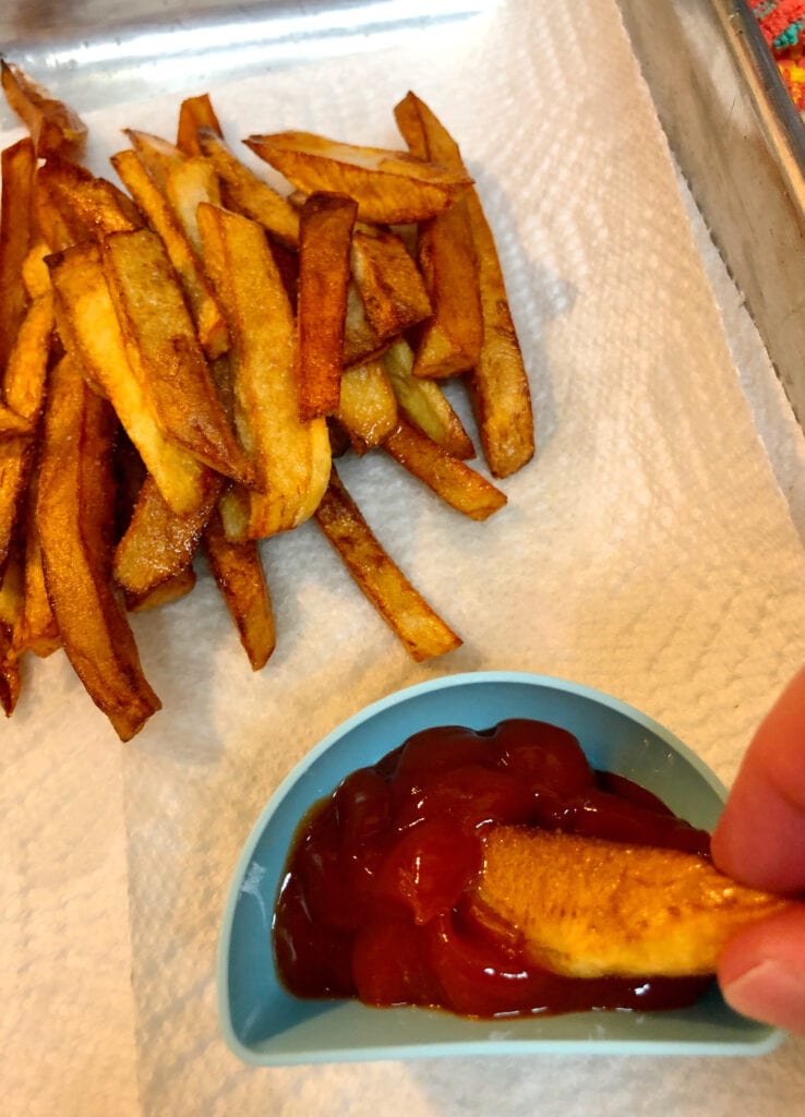 Dipping French Fry in Sauce