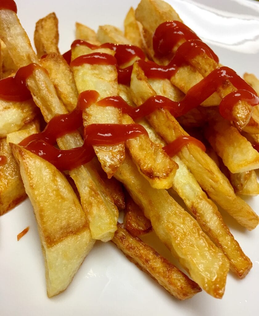 French Fries Drizzled with Ketchup