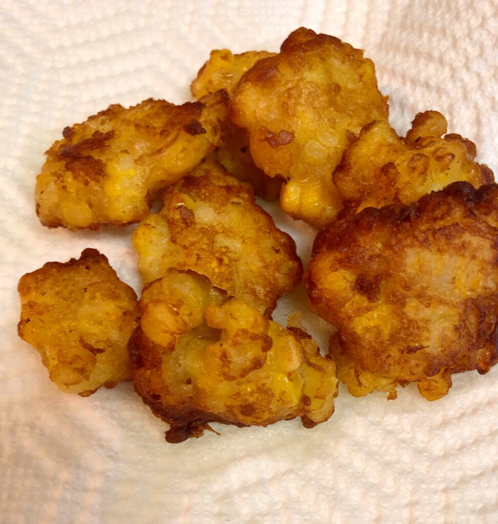 Fresh Corn Fritters Draining on Paper Towels