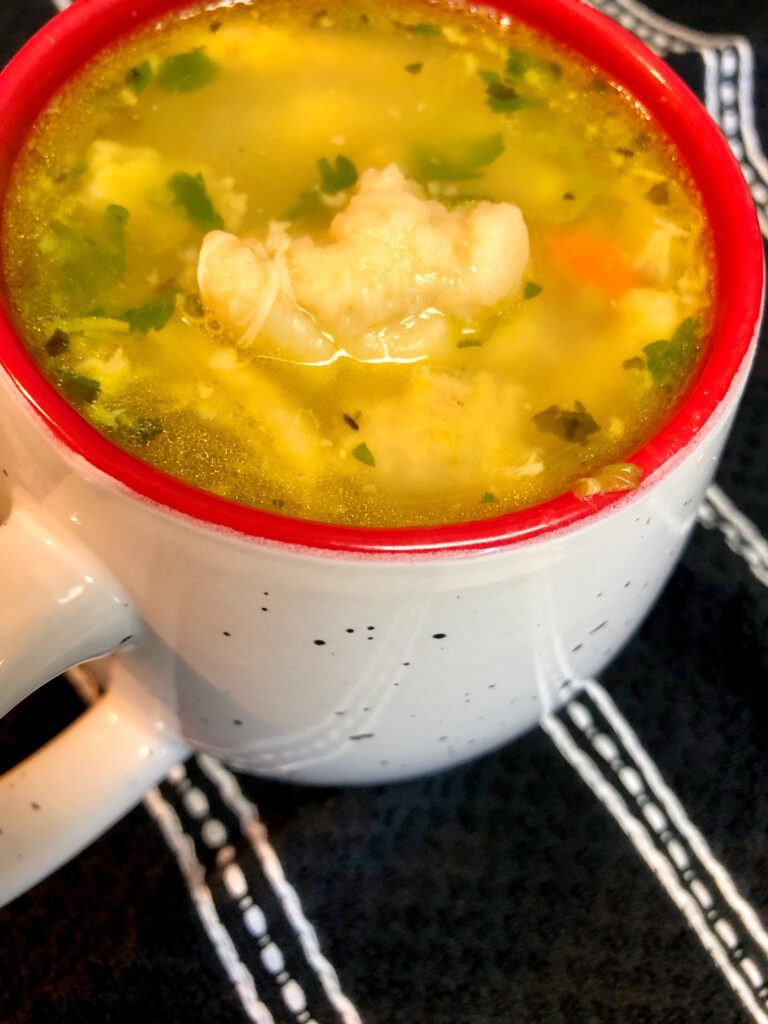 Cup of Chicken Soup with Dumplings