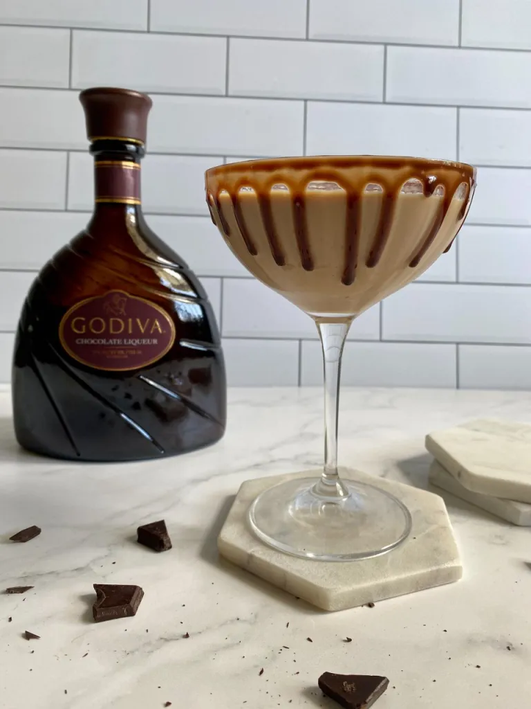 Godiva-chocolate-martini-in-a-tall-glass-with-chocolate-syrup-drizzle