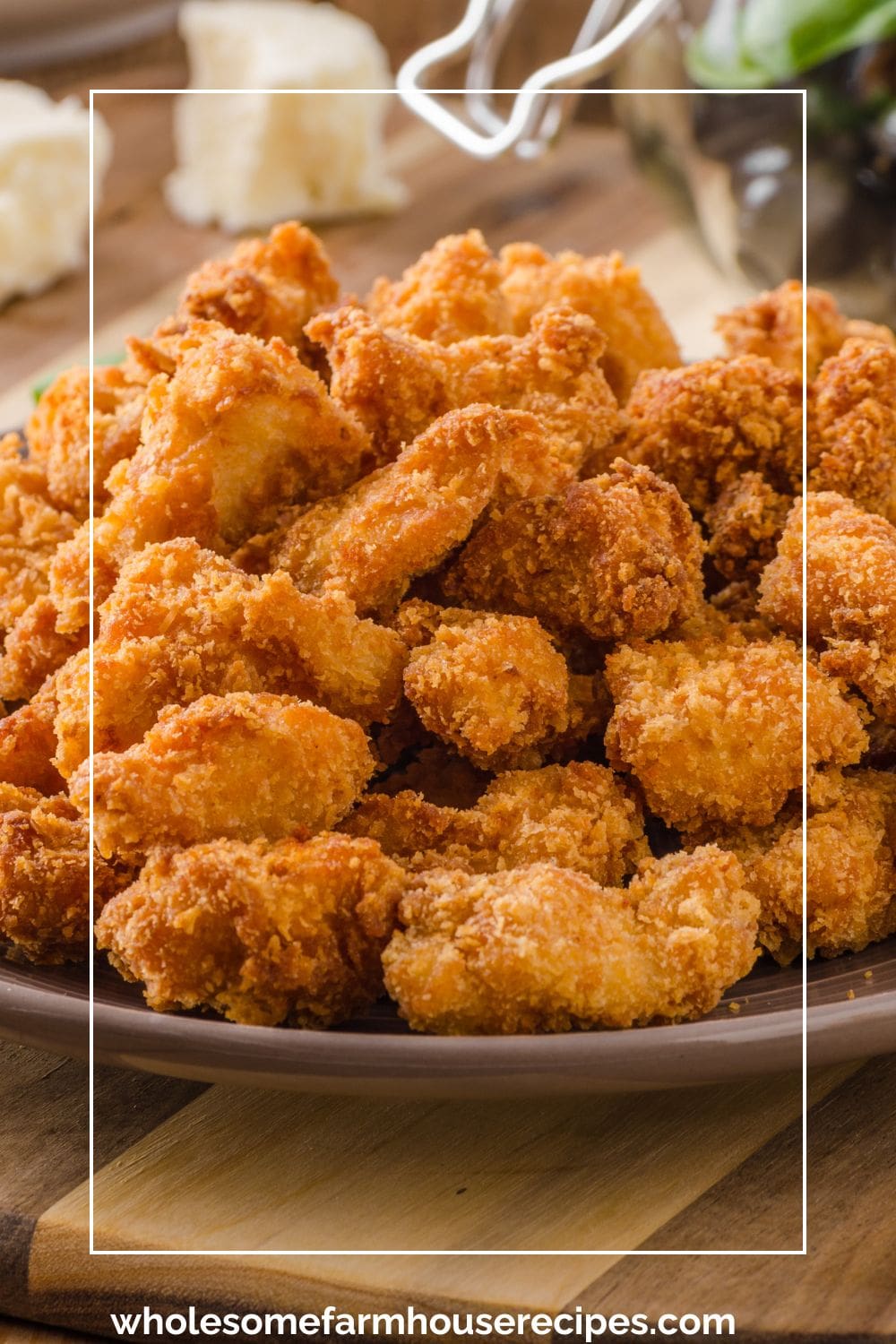 Homemade Crispy Popcorn Chicken Piled High on a Plate