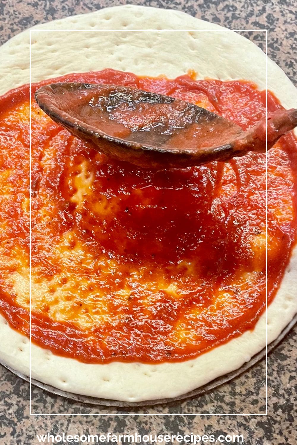 Spooning Pizza Sauce on Dough